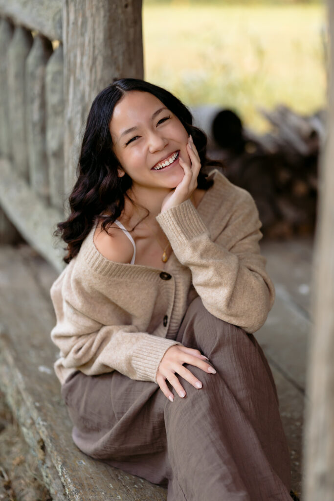 fall senior photos at a rustic cabin in minnesota