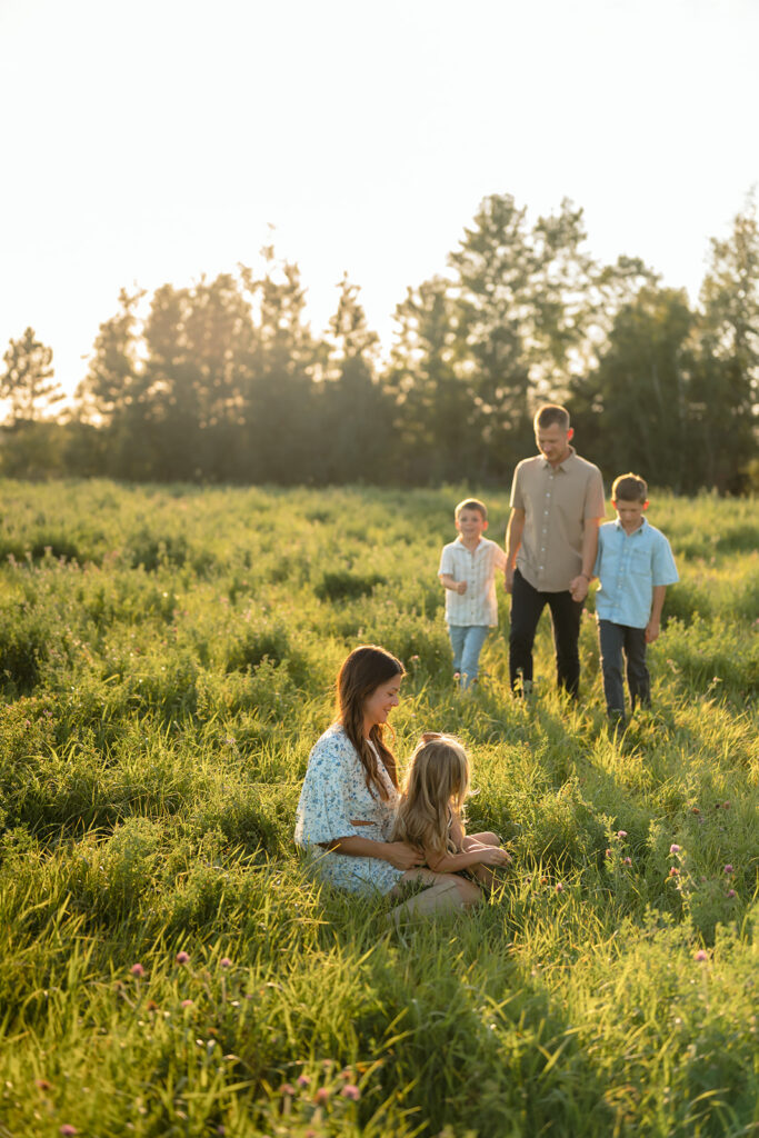mom and dad and their three kids during their sweet family photos at home