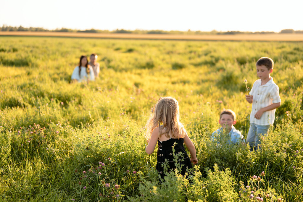 mom and dad and their three kids during their sweet family photos at home