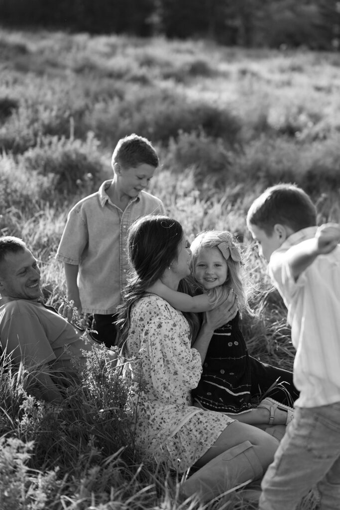 mom and dad and their three kids during their sweet family photos at home