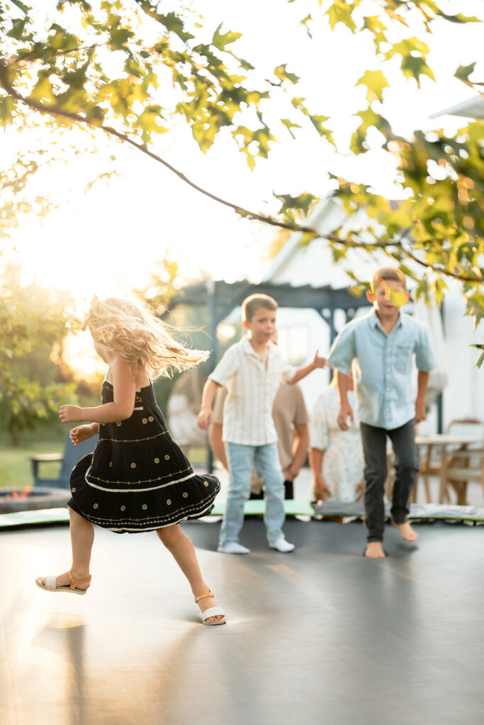 kids playing in their backyard as we capture sweet family photos at home