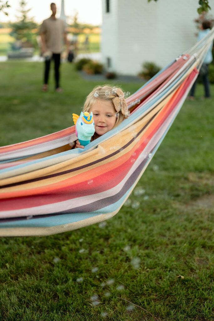 kids playing in their backyard as we capture sweet family photos at home
