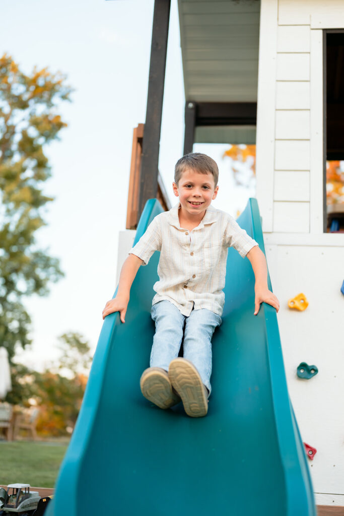 boy going down the slide