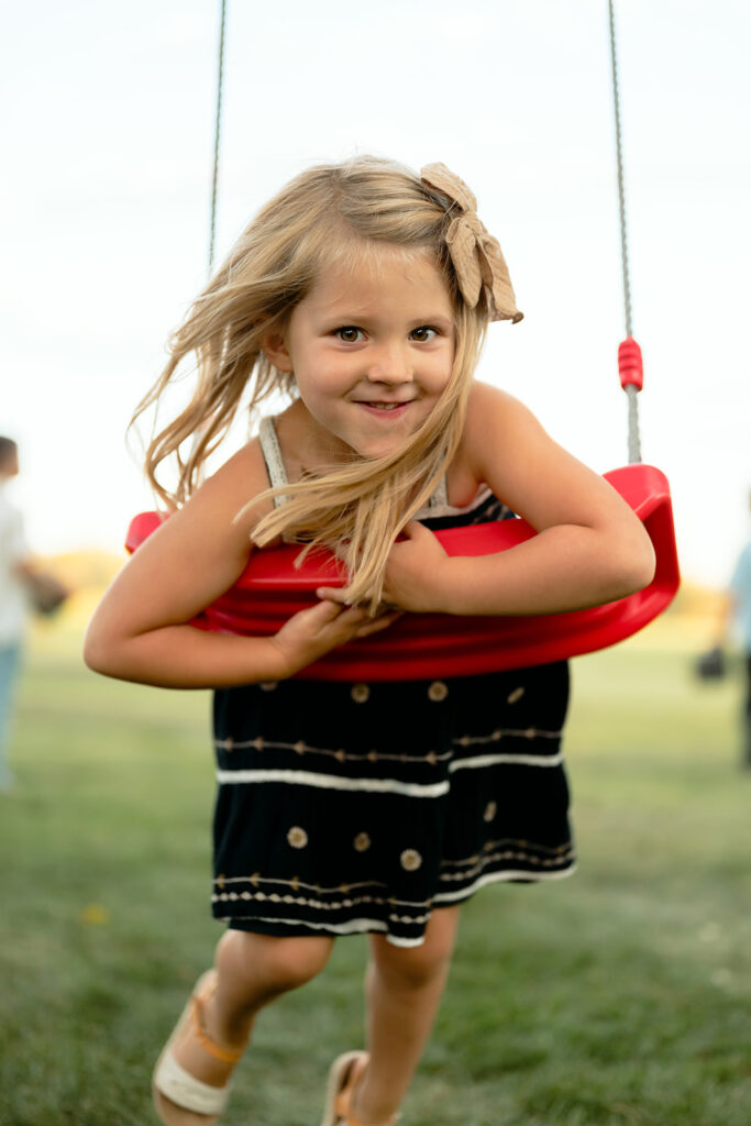 little girl on the swings
