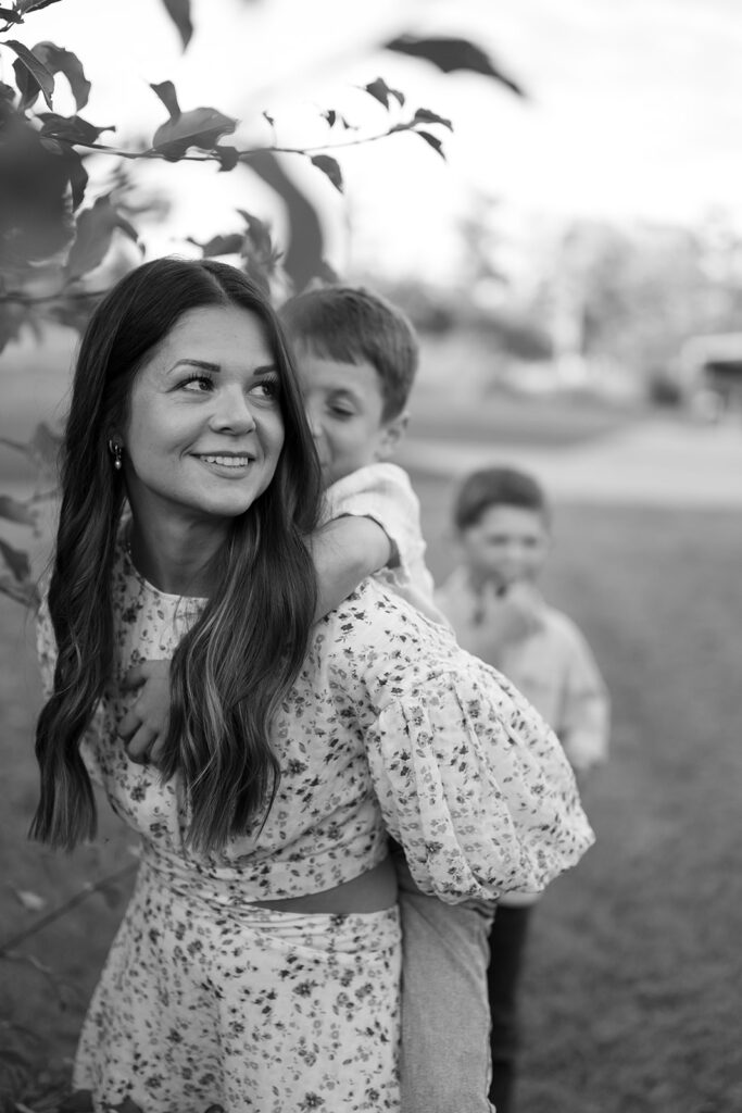family apple picking in their backyard garden