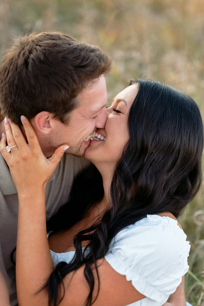 playful romantic engagement photos in a field in bemidji mn