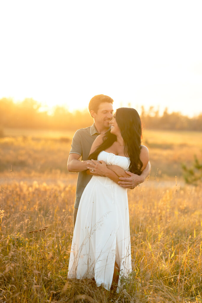 golden hour romantic engagement photos in a field in bemidji mn