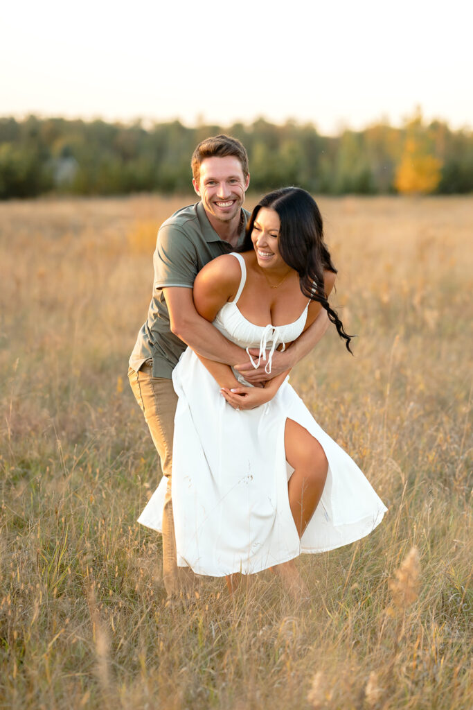 golden hour romantic engagement photos in a field in bemidji mn