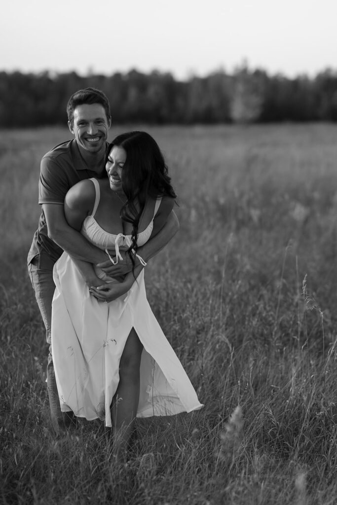 romantic field engagement moments in black and white