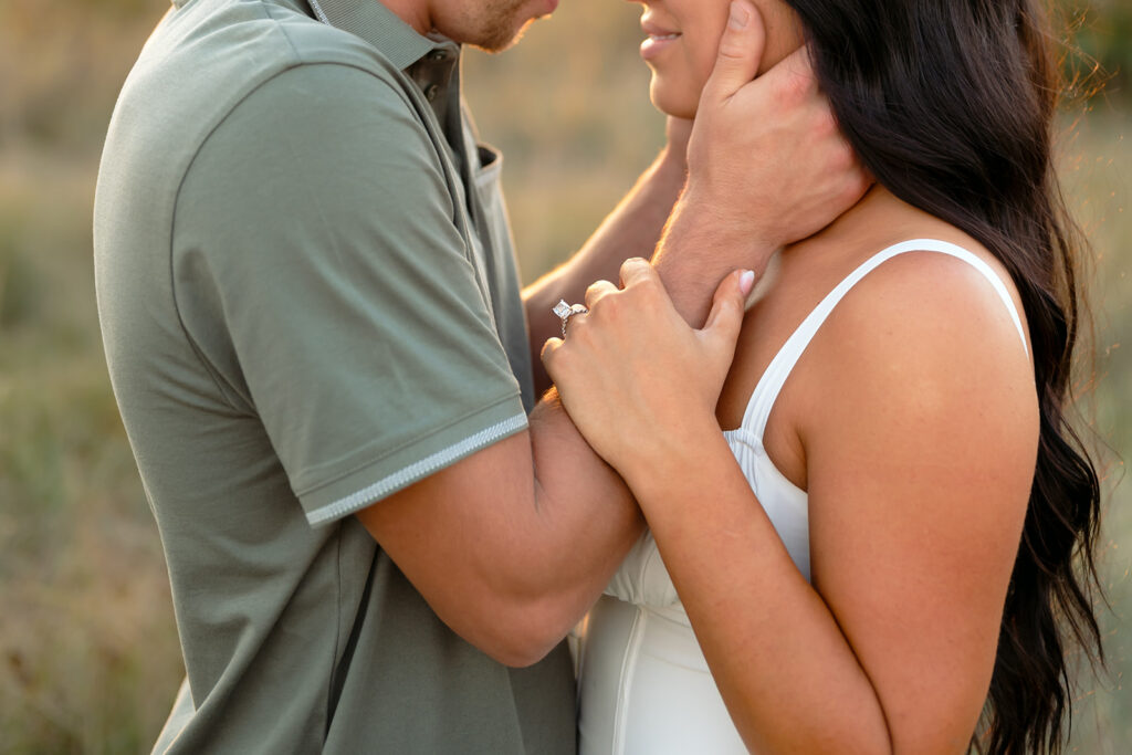 playful romantic engagement photos in a field in bemidji mn