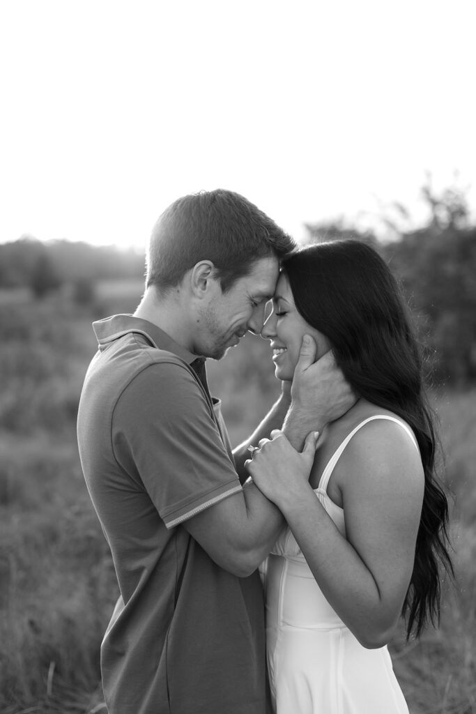 romantic field engagement moments in black and white