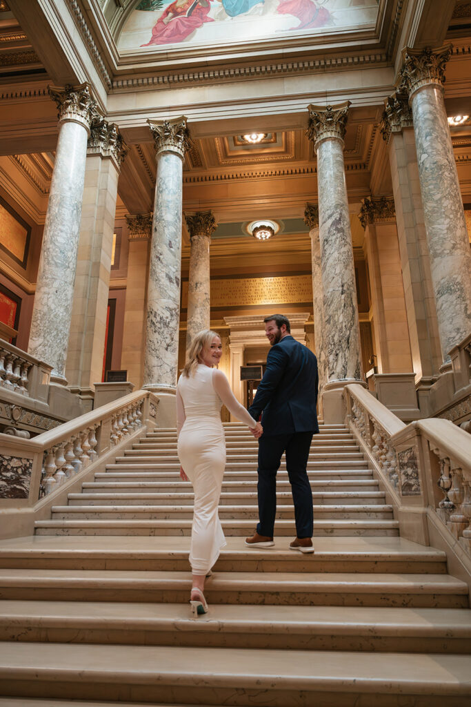 elegant engagement session featuring marble columns and grand staircases in Minnesota