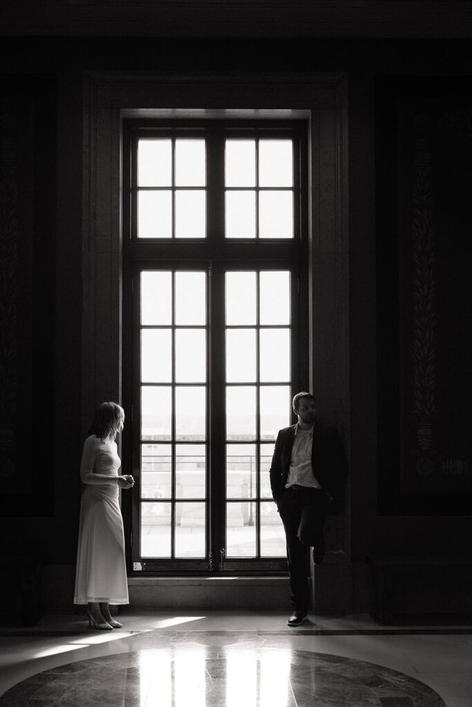 moody engagement portraits with natural window light at the Minnesota State Capitol