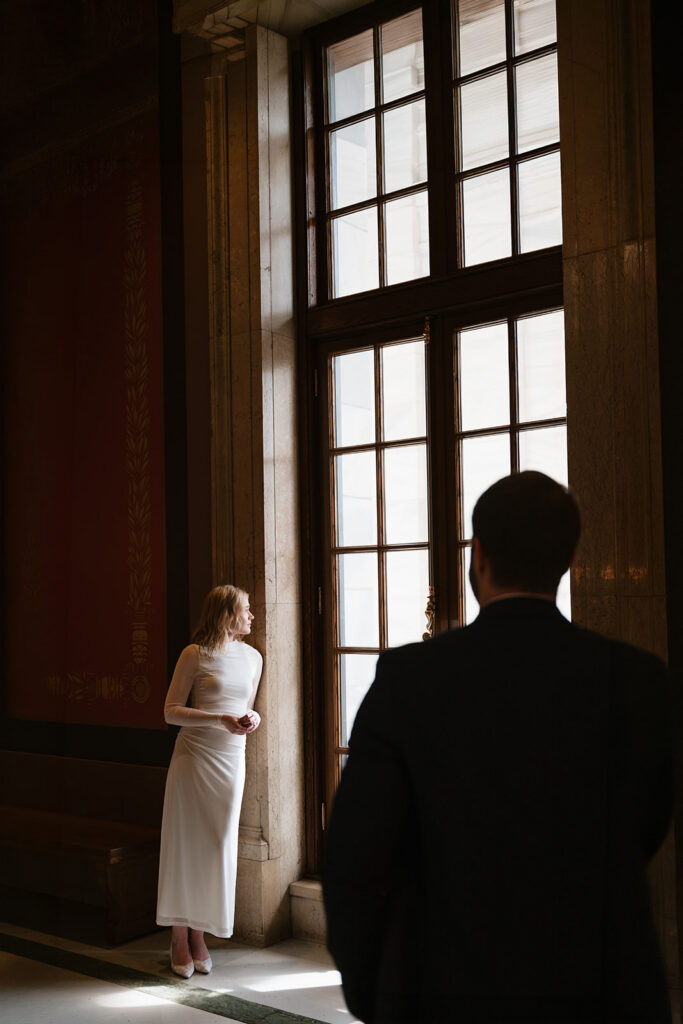 moody engagement portraits with natural window light at the Minnesota State Capitol