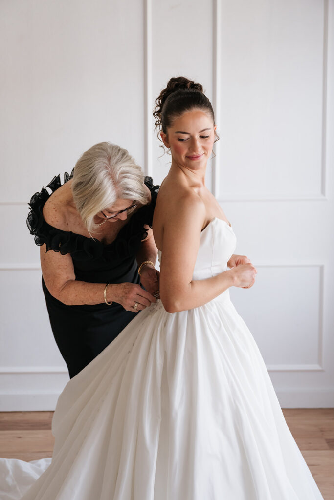 mom helping bride get ready