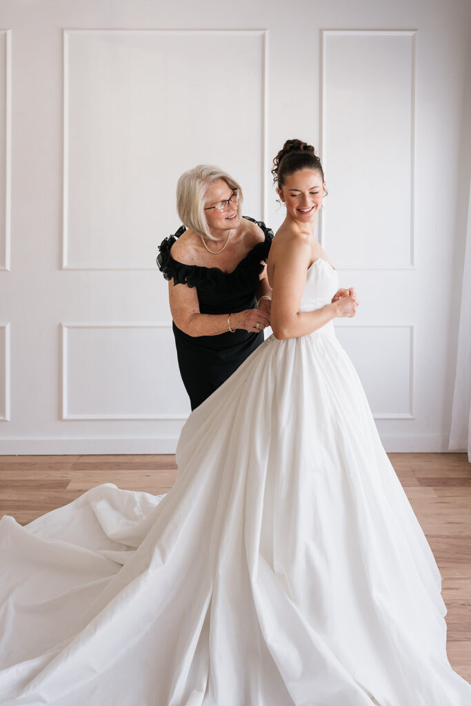 mom helping bride get ready