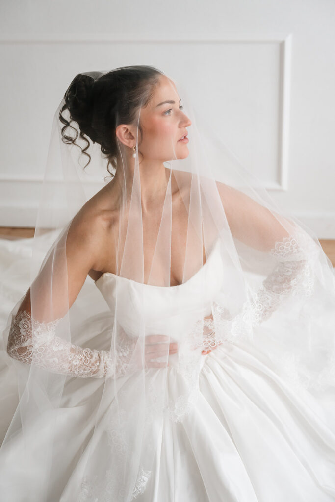 romantic wedding studio session with lace bridal gloves and cathedral veil in Bemidji MN