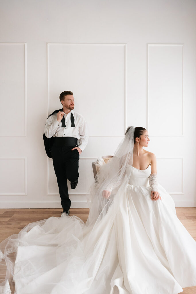 luxury studio wedding photography with classic black tuxedo and satin wedding gown in Bemidji MN