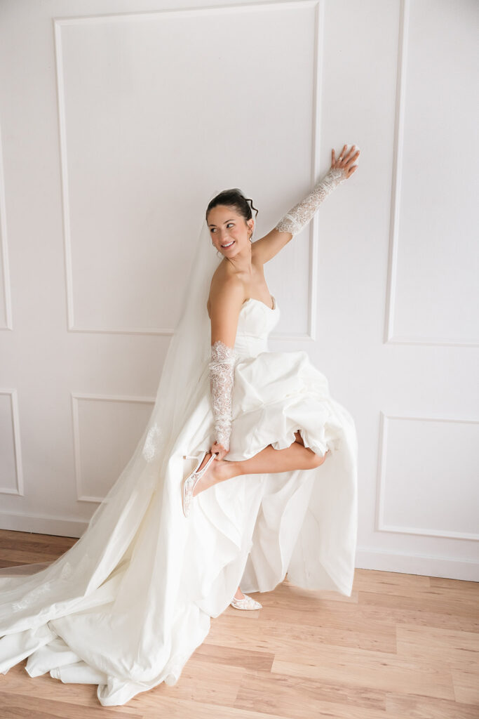 romantic wedding studio session with lace bridal gloves and cathedral veil in Bemidji MN