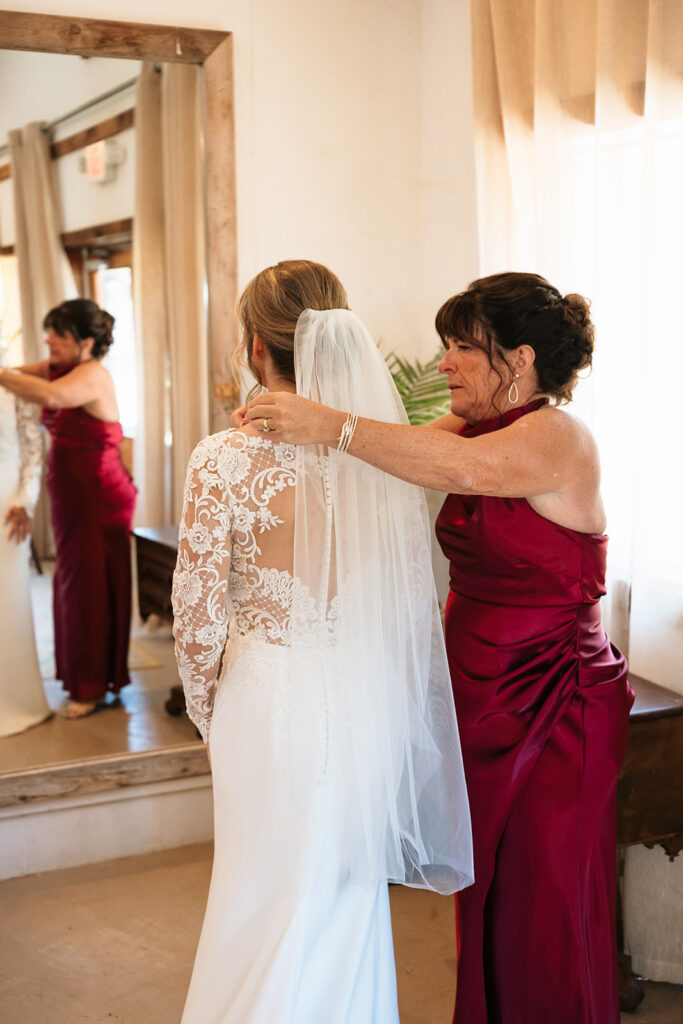 bride getting ready with mom