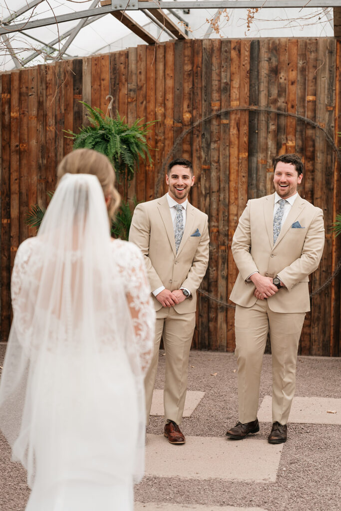 bride and brothers first look