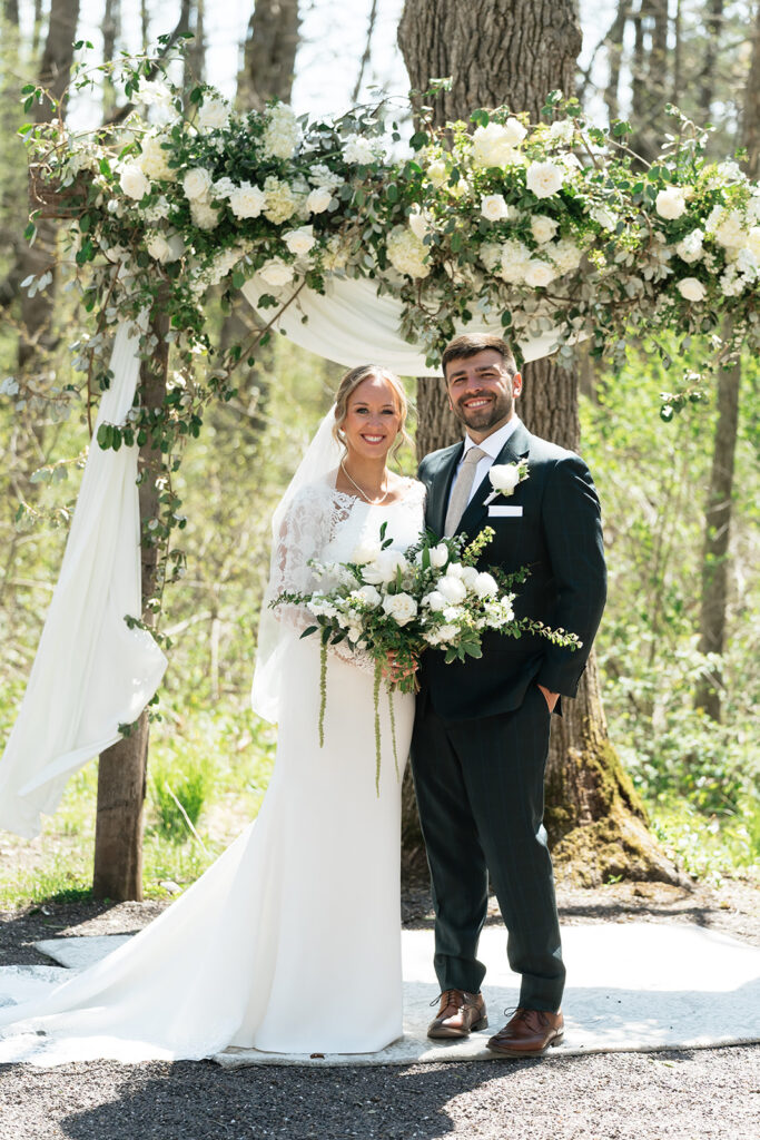 bride and groom at the outdoor ceremony space of The Atrium in Solon Springs, Wisconsin
