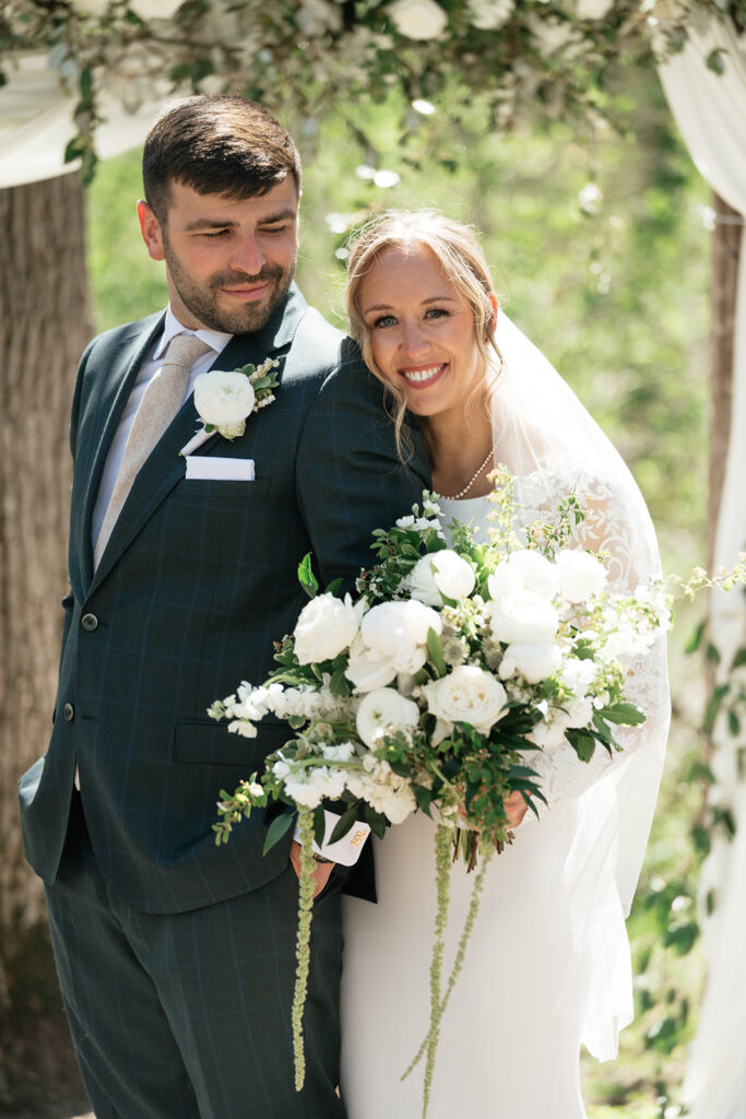 bride and groom at the outdoor ceremony space of The Atrium in Solon Springs, Wisconsin