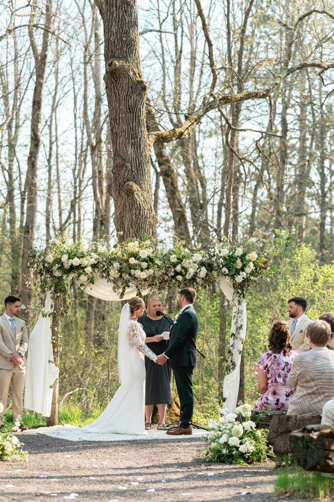 candid wedding ceremony moments at the atrium in solon springs ,wi