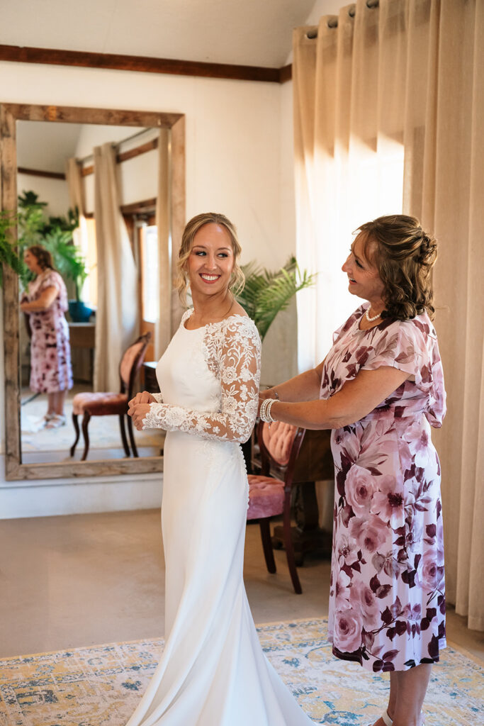 bride getting ready with mom