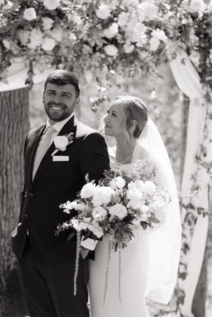 bride and groom at the outdoor ceremony space of The Atrium in Solon Springs, Wisconsin
