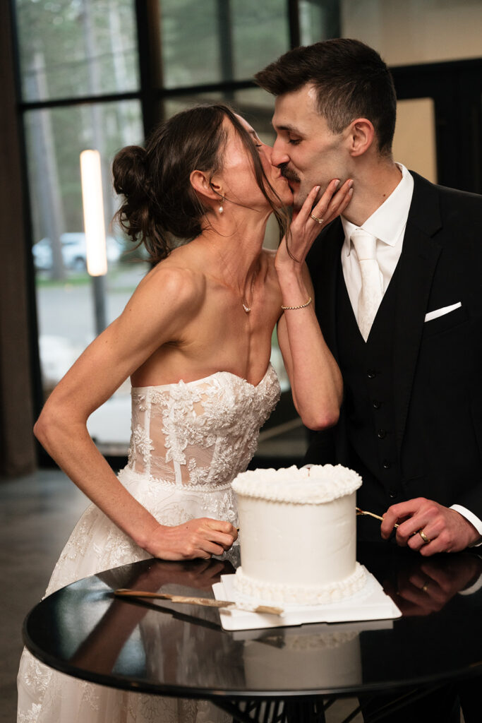 bride and groom cutting cake