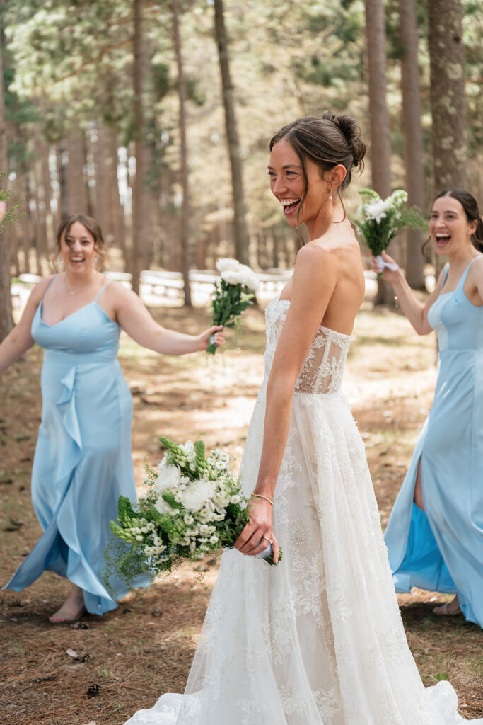 bride and bridesmaids in the forest