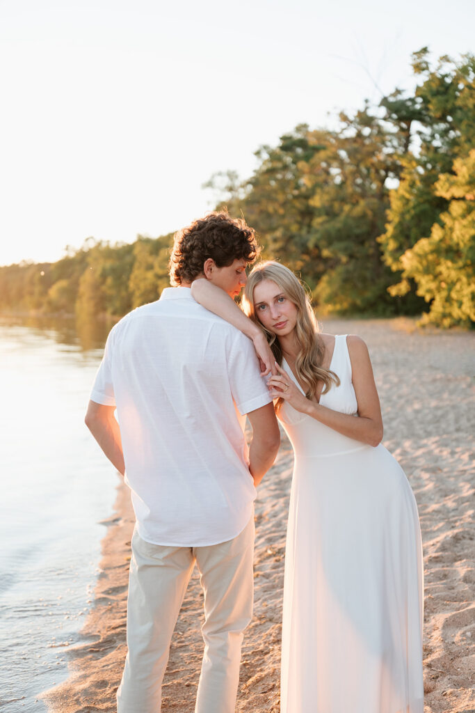 playful couple at the beach of lake bemidji