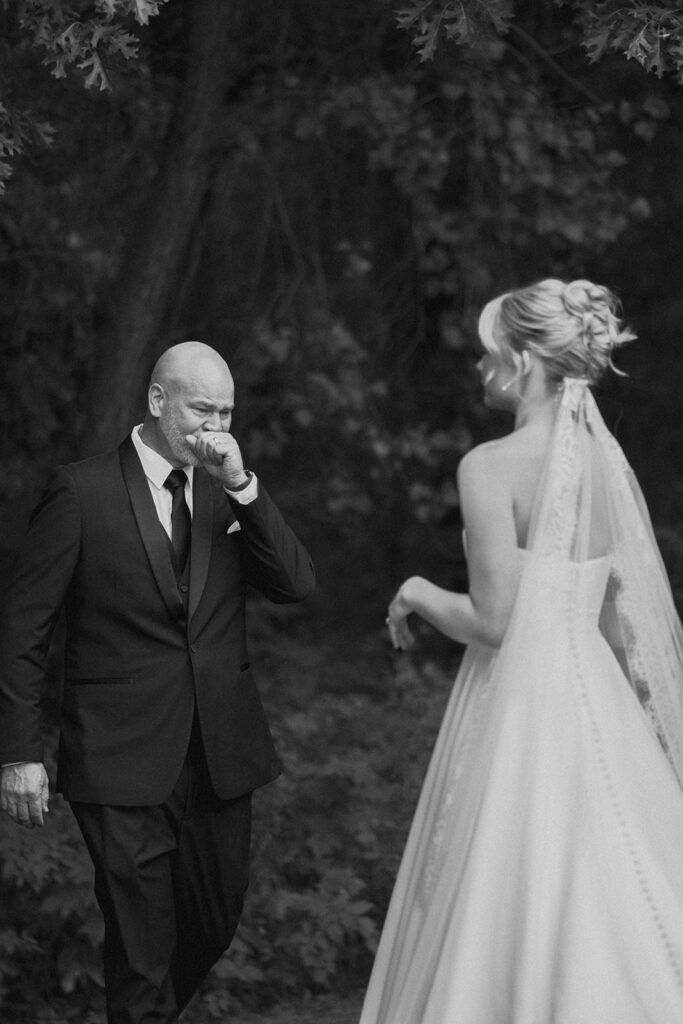 candid and emotional bride and dad first look
