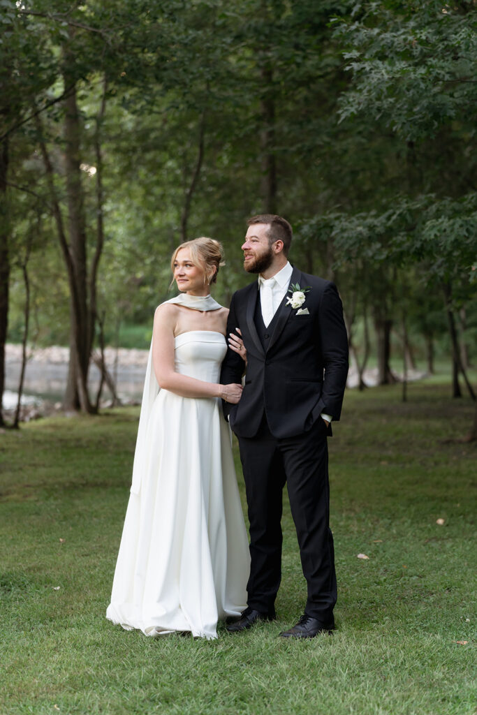 bride and groom surrounded by the lush greenery at northern oaks events during their wedding day
