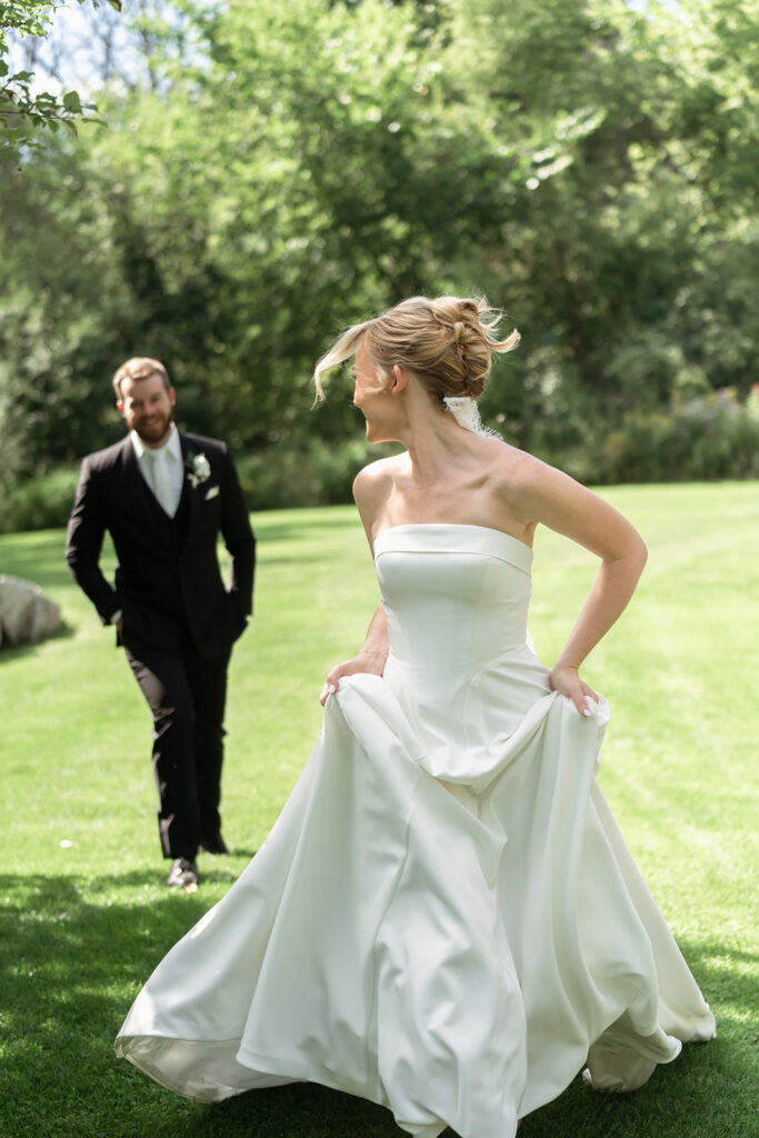 bride and groom surrounded by the lush greenery at northern oaks events during their wedding day